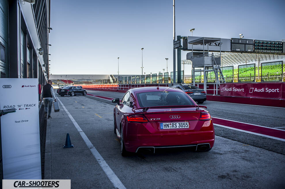 Audi – rear view, red at a racetrack pit lane