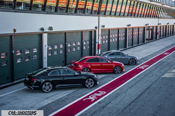 Audi – rear three-quarter, black parked in pit lane