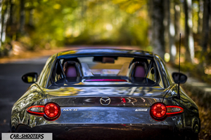 Mazda MX 5 ND – rear view, grey metallic on a country road