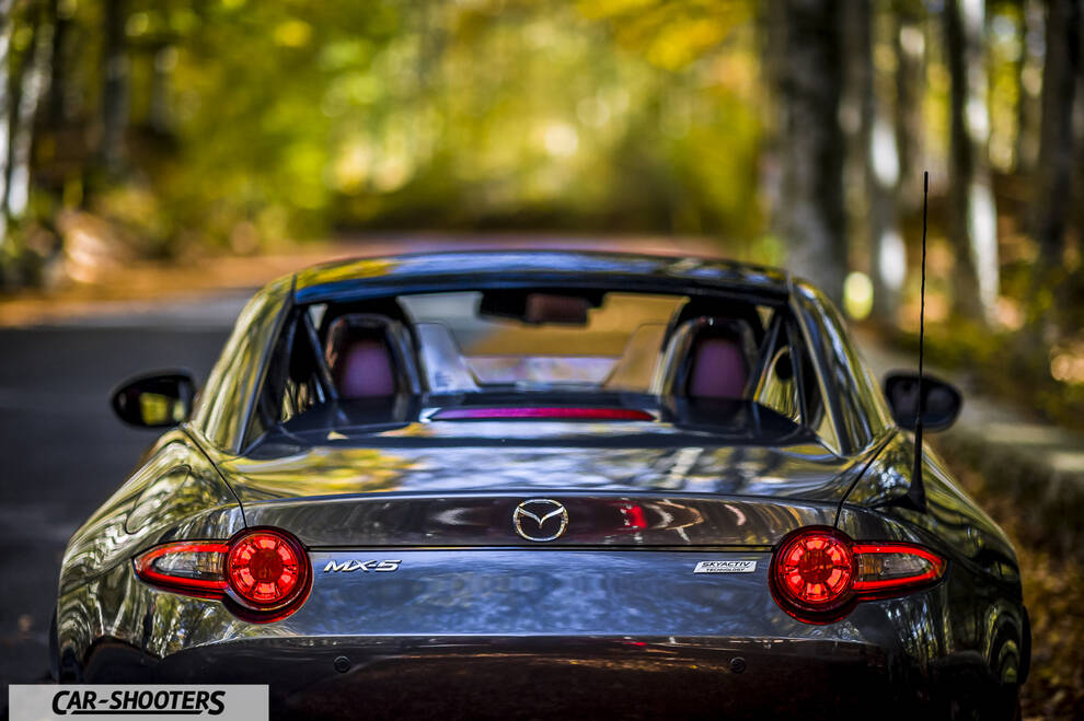 Mazda MX 5 ND – rear view, grey metallic on a country road