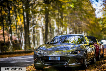 Mazda MX 5 ND – front three-quarter, grey metallic on a tree lined road