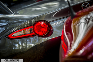 Mazda MX 5 ND – rear view, grey metallic with illuminated taillight
