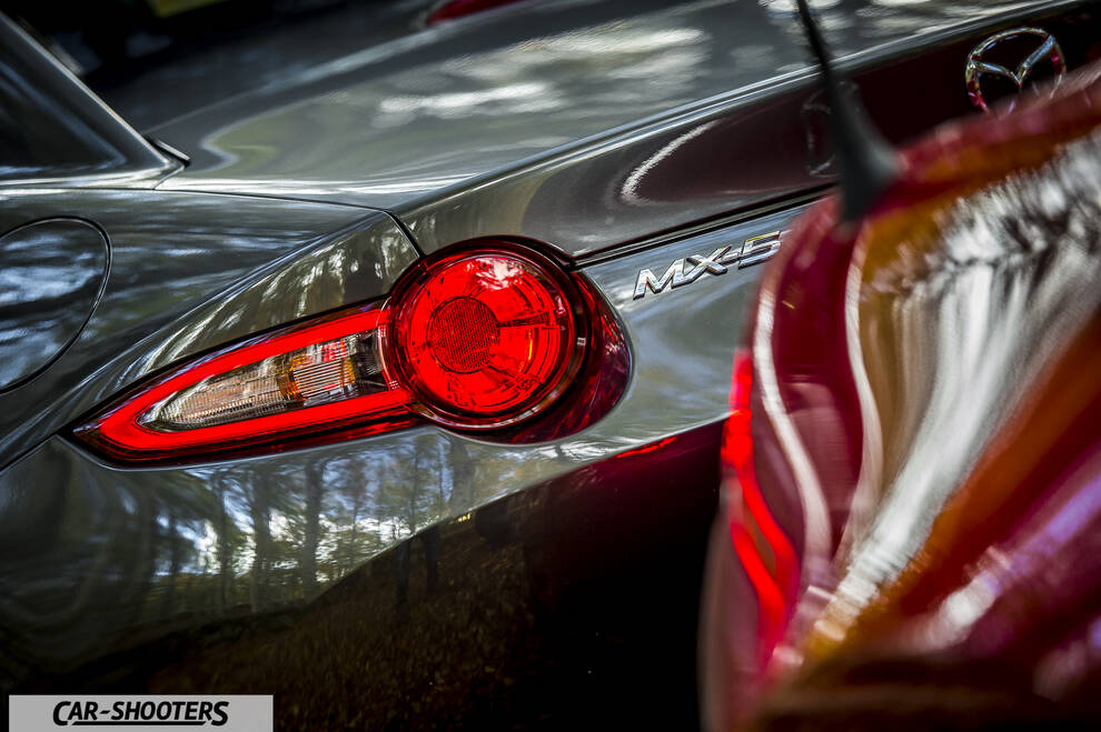 Mazda MX 5 ND – rear view, grey metallic with illuminated taillight