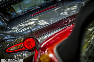 Mazda MX 5 ND – rear view, grey metallic with visible taillight and badge
