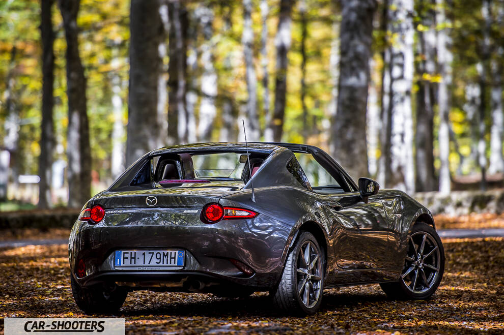 Mazda MX 5 ND – rear three-quarter, grey metallic on a forest road