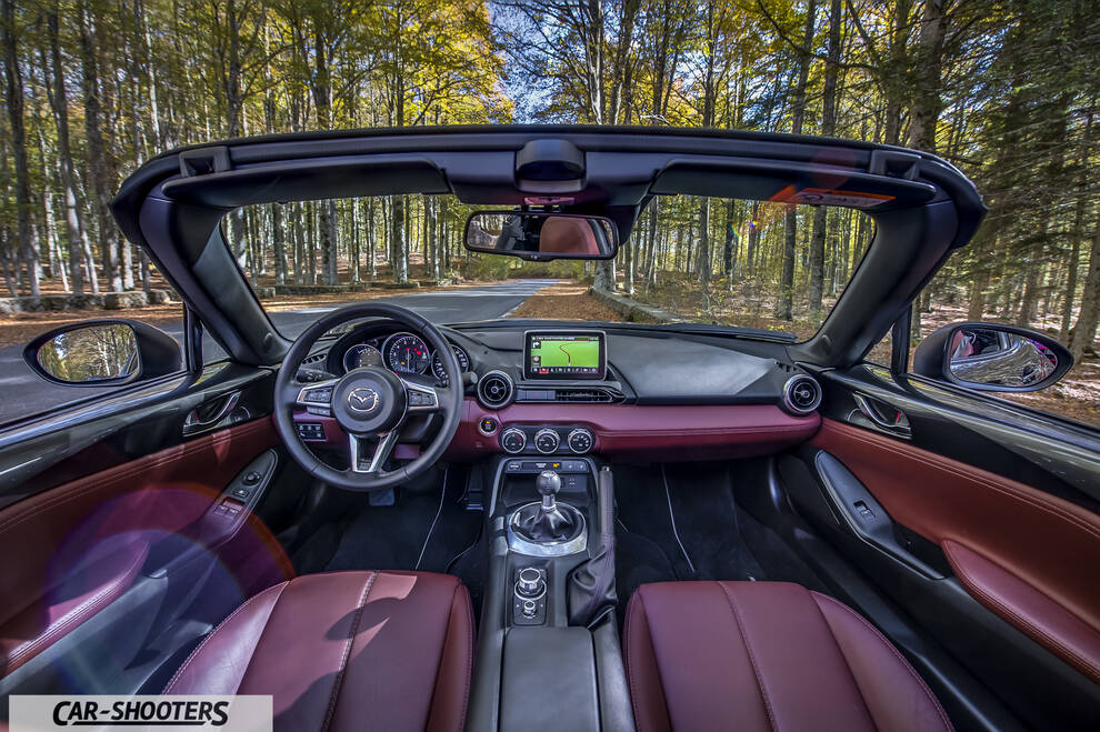 Mazda MX 5 ND – dashboard, against an autumn forest backdrop