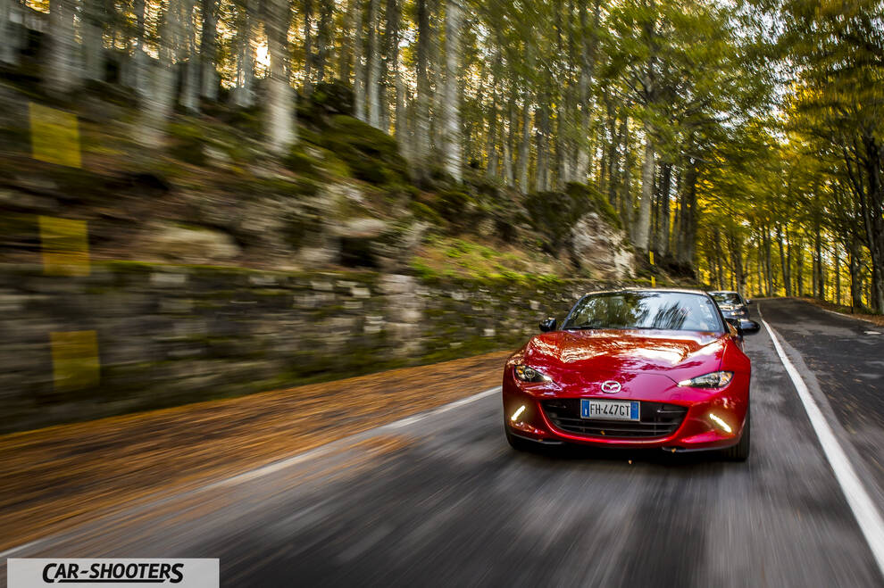 Mazda MX 5 ND – front three-quarter, red on a forest road