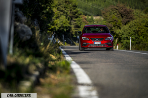 Seat Leon Cupra – front three-quarter, red metallic on a country road