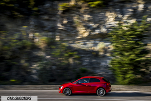 Seat Leon Cupra – side profile, red against a mountain backdrop