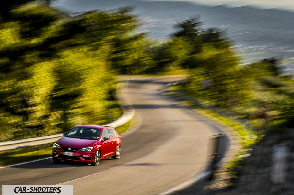 Seat Leon Cupra – front three-quarter, red on a winding mountain road