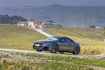 front three-quarter, grey metallic against a mountain backdrop