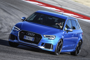 Audi – front three-quarter, blue on a race track