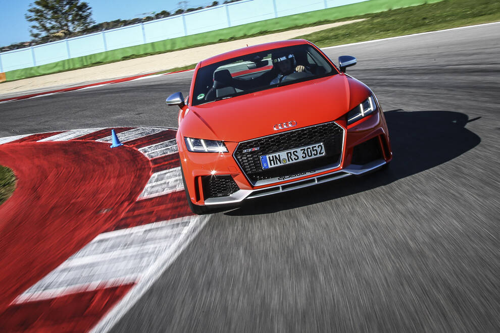Audi – front three-quarter, red on a race track
