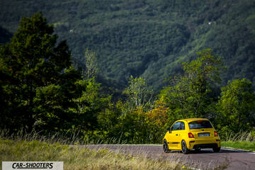 Abarth 595 Competizione – rear three-quarter, yellow on a country road