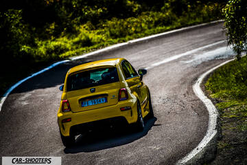 Abarth 595 Competizione – rear three-quarter, yellow on a country road