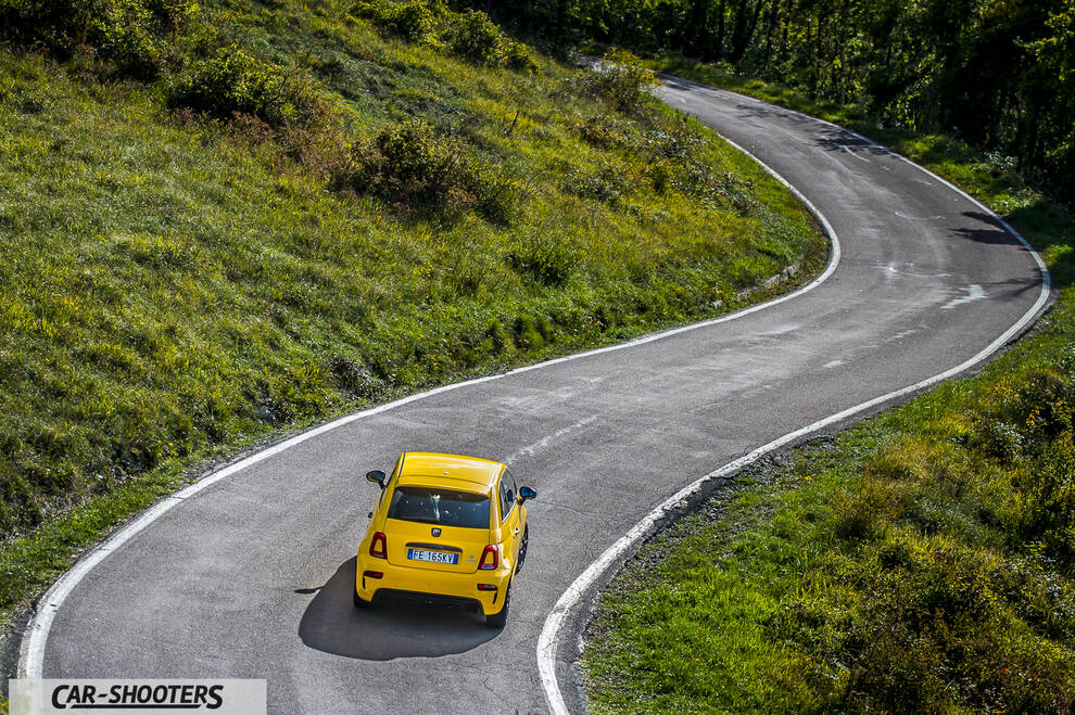 Abarth 595 Competizione – rear view, yellow on a winding country road