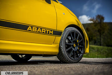 Abarth 595 Competizione – side profile, yellow on an asphalt road