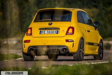 Abarth 595 Competizione – rear three-quarter, yellow on a country road