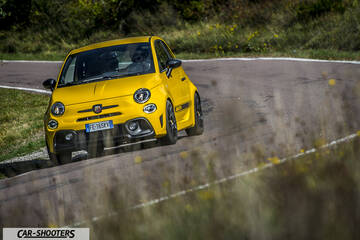Abarth 595 Competizione – front three-quarter, yellow on a country road