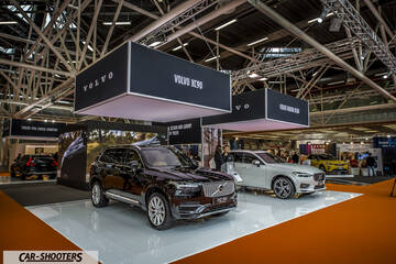 front three-quarter, dark brown on an auto show display