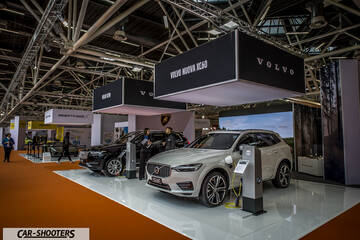 front three-quarter, white at an indoor car exhibition