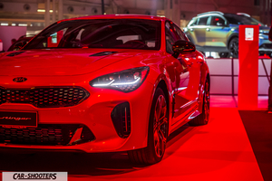 front three-quarter, red at a car show