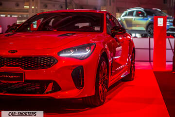front three-quarter, red at a car show