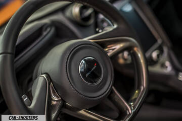dashboard, leather steering wheel close-up