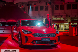 front three-quarter, red at an indoor event