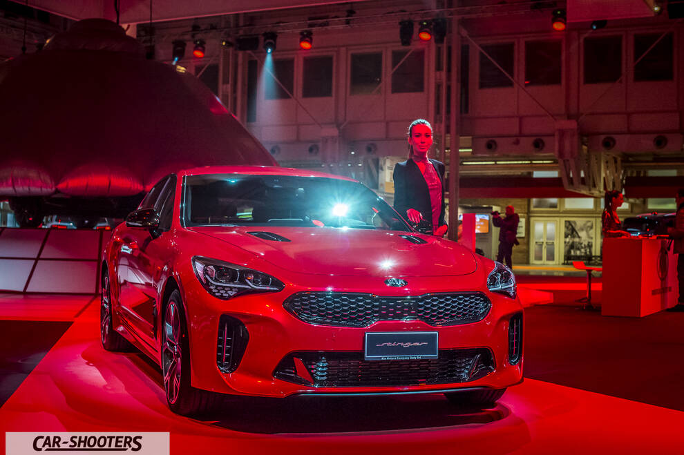 front three-quarter, red at an indoor event