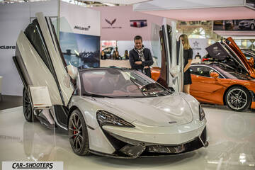 front three-quarter, silver at an auto show
