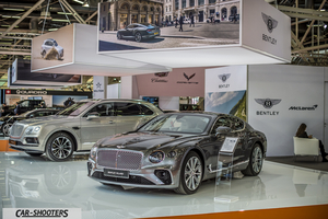 front three-quarter, grey metallic at a car exhibition