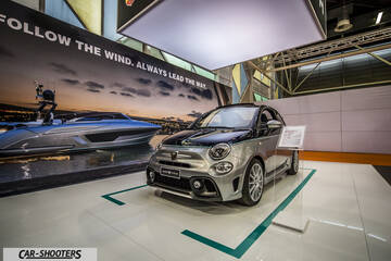 front three-quarter, silver and black on an auto show display platform