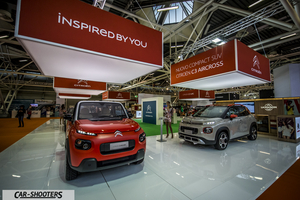 front three-quarter, red at an indoor auto show