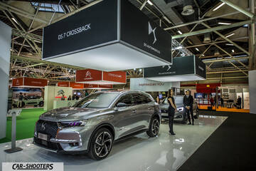 front three-quarter, silver at an indoor auto show