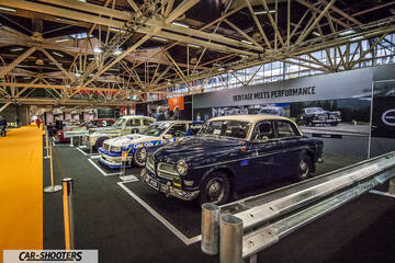 front three-quarter, dark blue in an indoor exhibition hall
