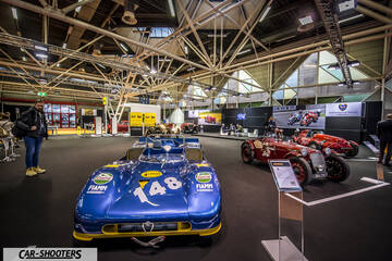 front three-quarter, blue at an indoor car show