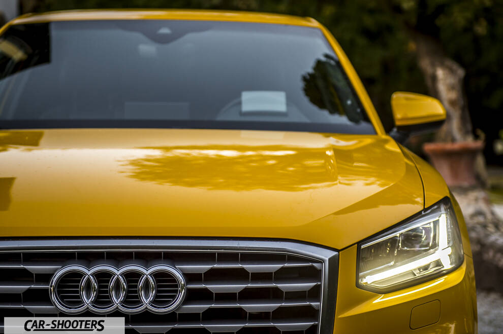 Audi Q2 – front three-quarter, yellow parked outdoors