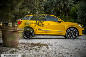 Audi Q2 – side profile, yellow on a gravel path