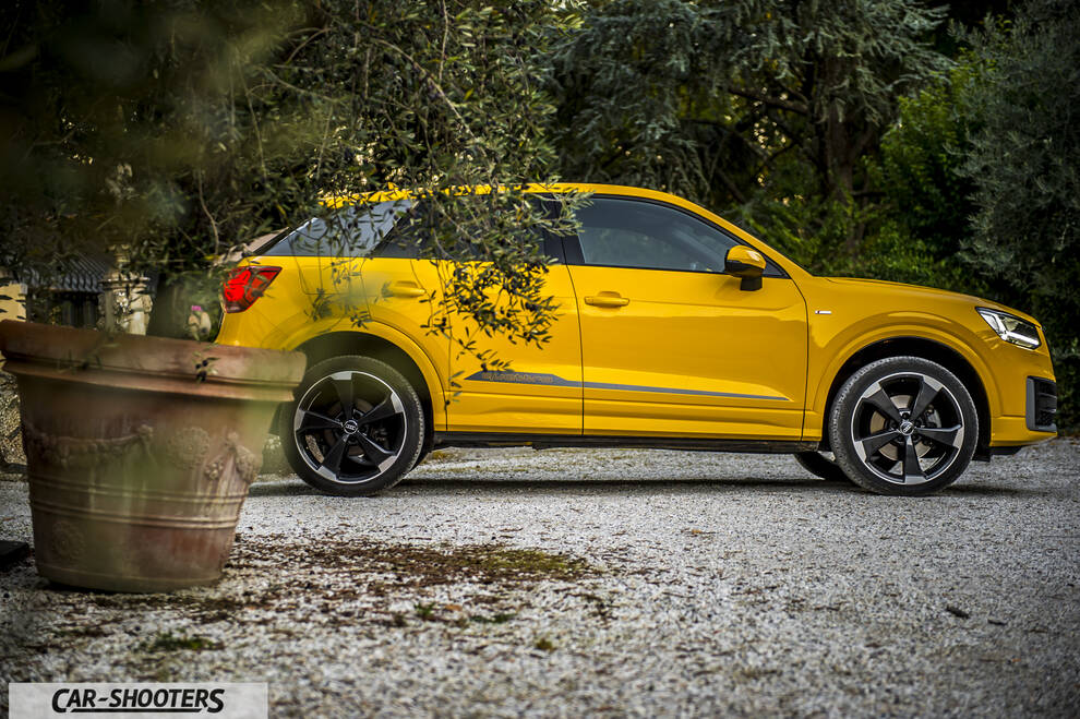 Audi Q2 – side profile, yellow on a gravel path