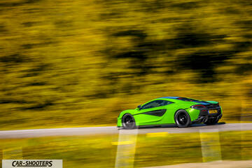Mclaren 570S – rear three-quarter, green on a country road with motion blur