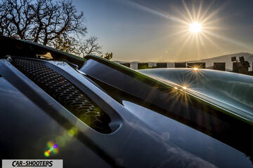 Mclaren 570S – detail, hood vent close-up against a sunset backdrop
