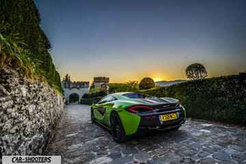 Mclaren 570S – rear three-quarter, green on a cobbled driveway