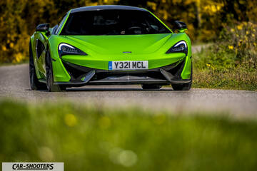 Mclaren 570S – front three-quarter, bright green on a country road