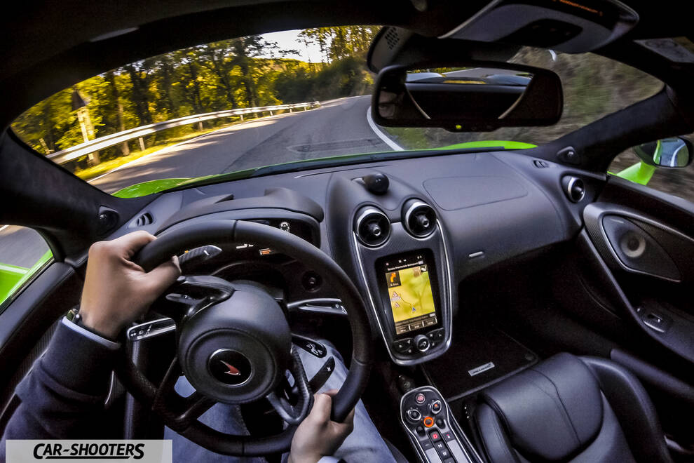 Mclaren 570S – interior, driving on a winding road
