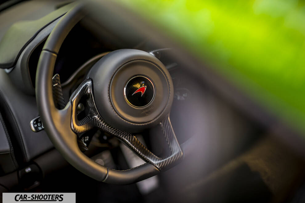 Mclaren 570S – dashboard, leather steering wheel close up