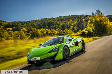 Mclaren 570S – front three-quarter, bright green on a country road