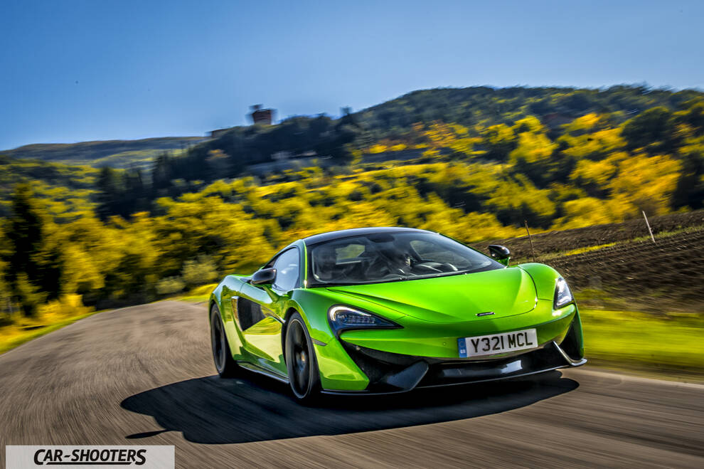 Mclaren 570S – front three-quarter, bright green on a country road