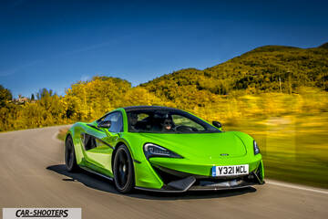 Mclaren 570S – front three-quarter, bright green on a country road