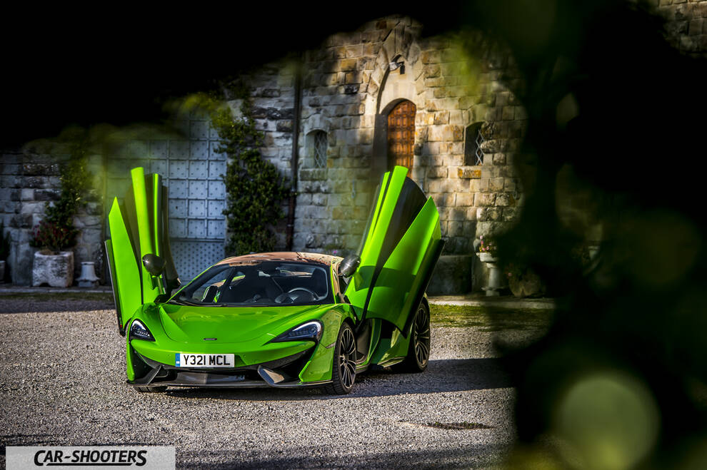 Mclaren 570S – front three-quarter, bright green parked with open doors